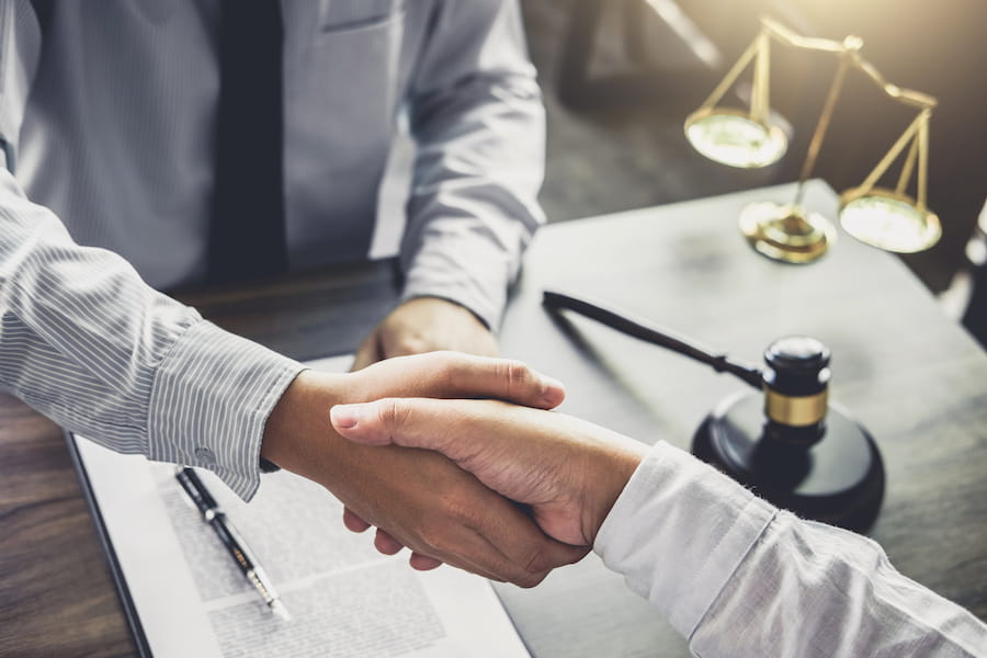 New Business Lawyer shaking hands with client