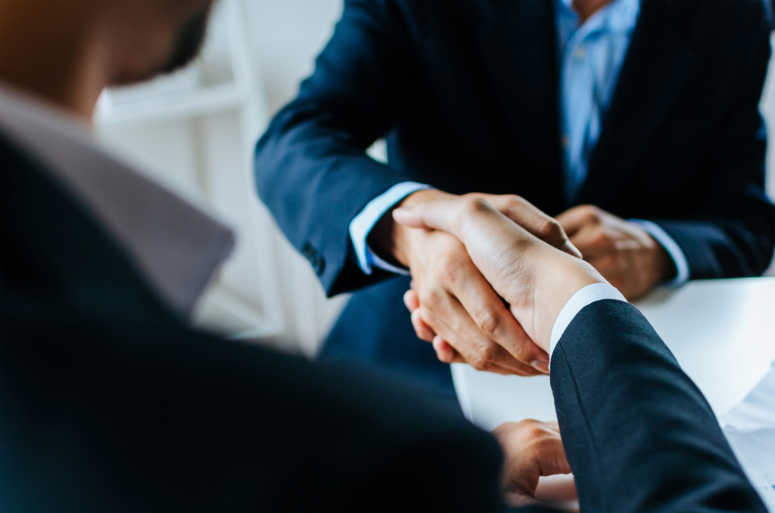 Startup business lawyer shaking hands with client