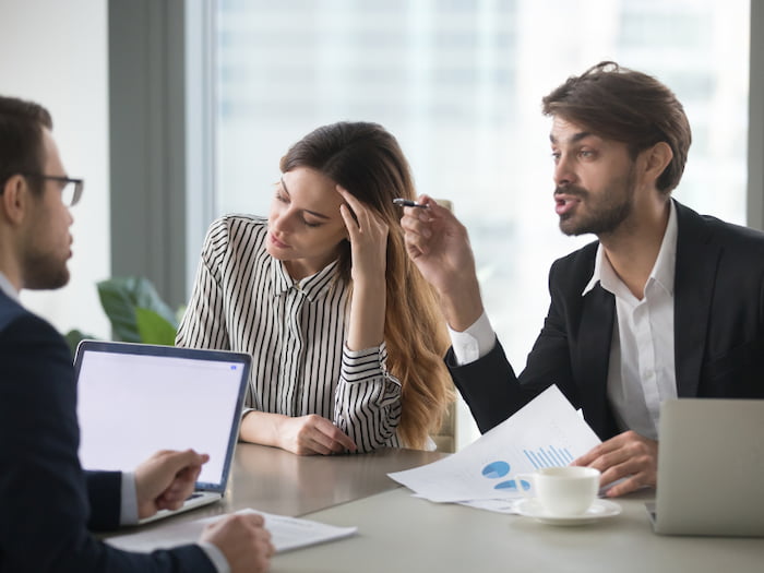 Business dispute attorney working with partners